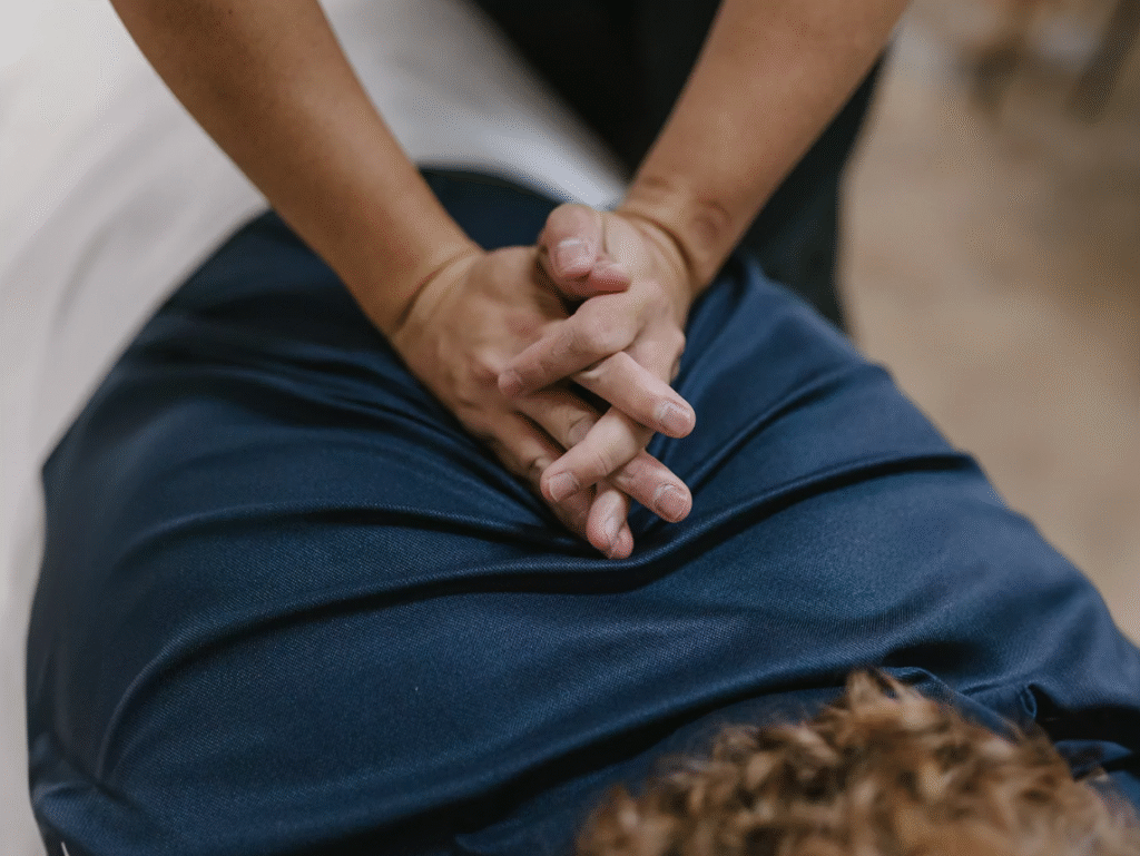Chiropractor performing a gentle spinal adjustment on a patient to restore alignment and relieve pain