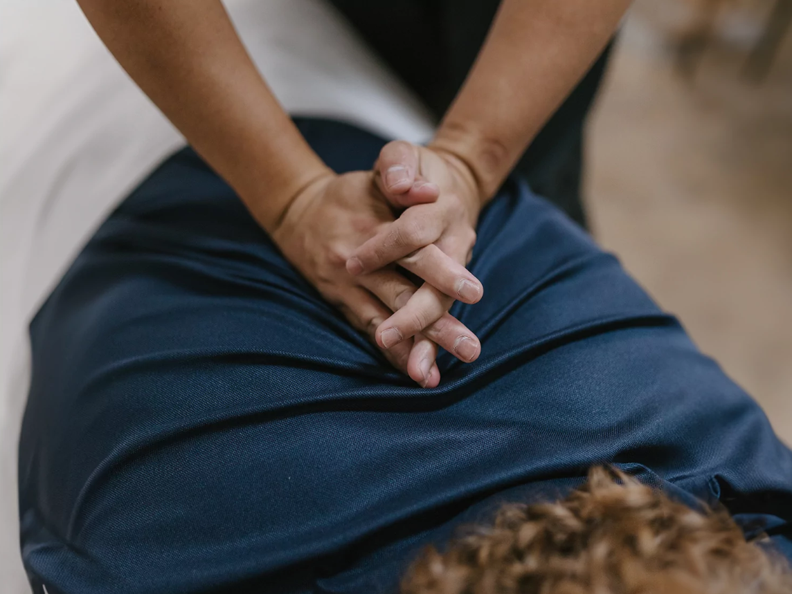 Chiropractor performing a gentle spinal adjustment on a patient to restore alignment and relieve pain
